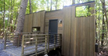 The Gateway Isidore wheelchair accessible tiny house in a beautiful forest.