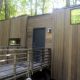 The Gateway Isidore wheelchair accessible tiny house in a beautiful forest.