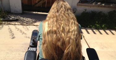 Having long hair symbolizes my right to make choices about my life as a person with a disability.