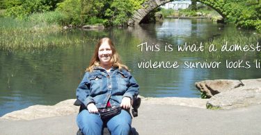 Karin in Central Park, NYC with caption "This is what a domestic violence survivor looks like."