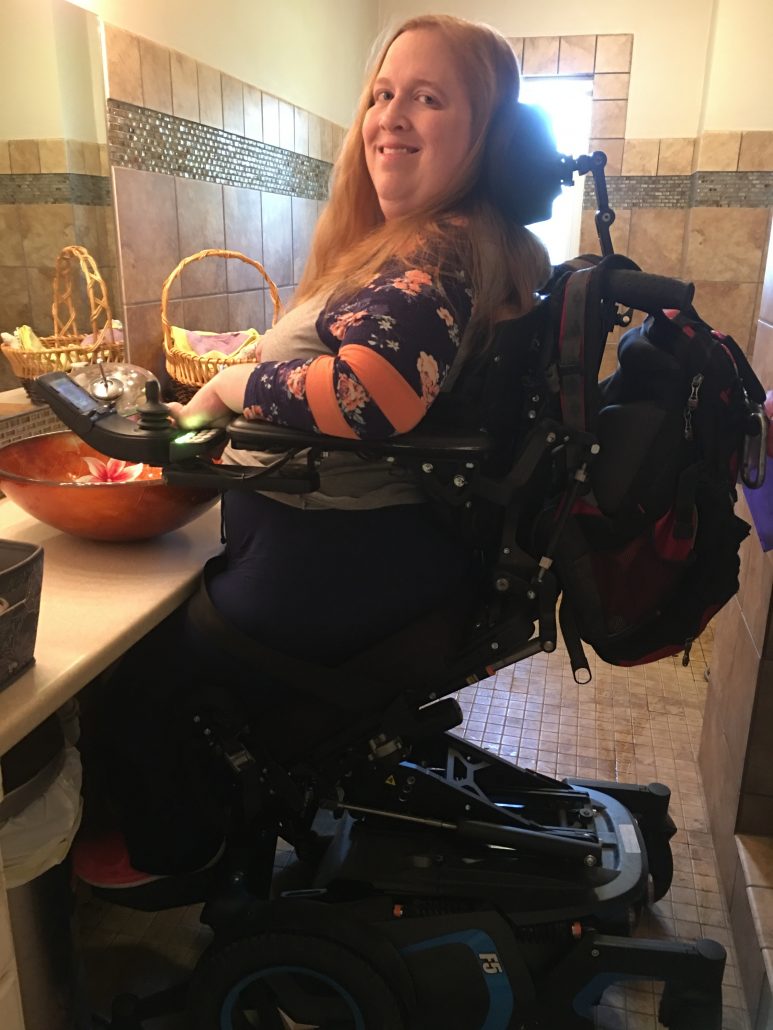 Partially standing at my sink in the Permobil F5 VS power wheelchair.