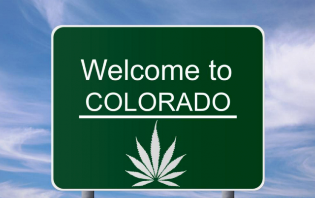Welcome to Colorado sign with cannabis leaf.