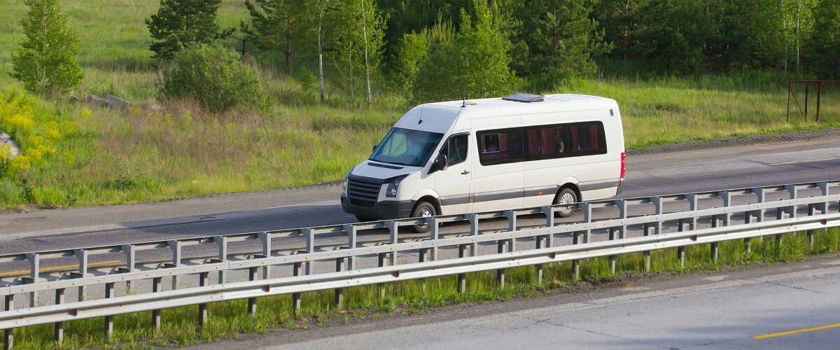 White van on a country road.