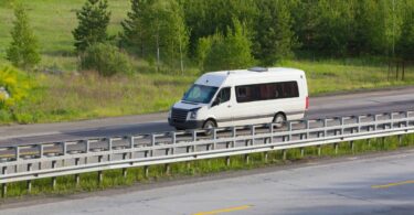White van on a country road.